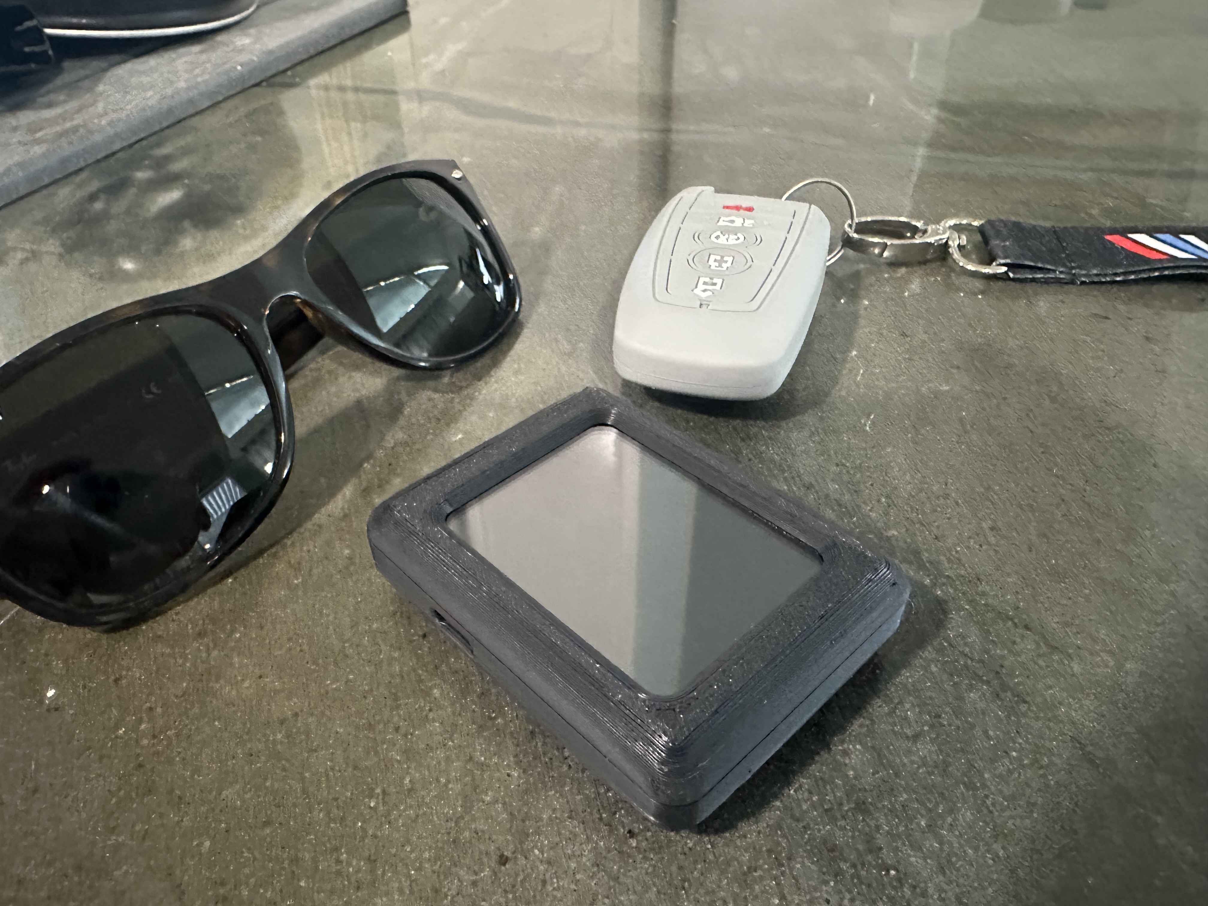 An early PAJR prototype beside sunglasses and car keys